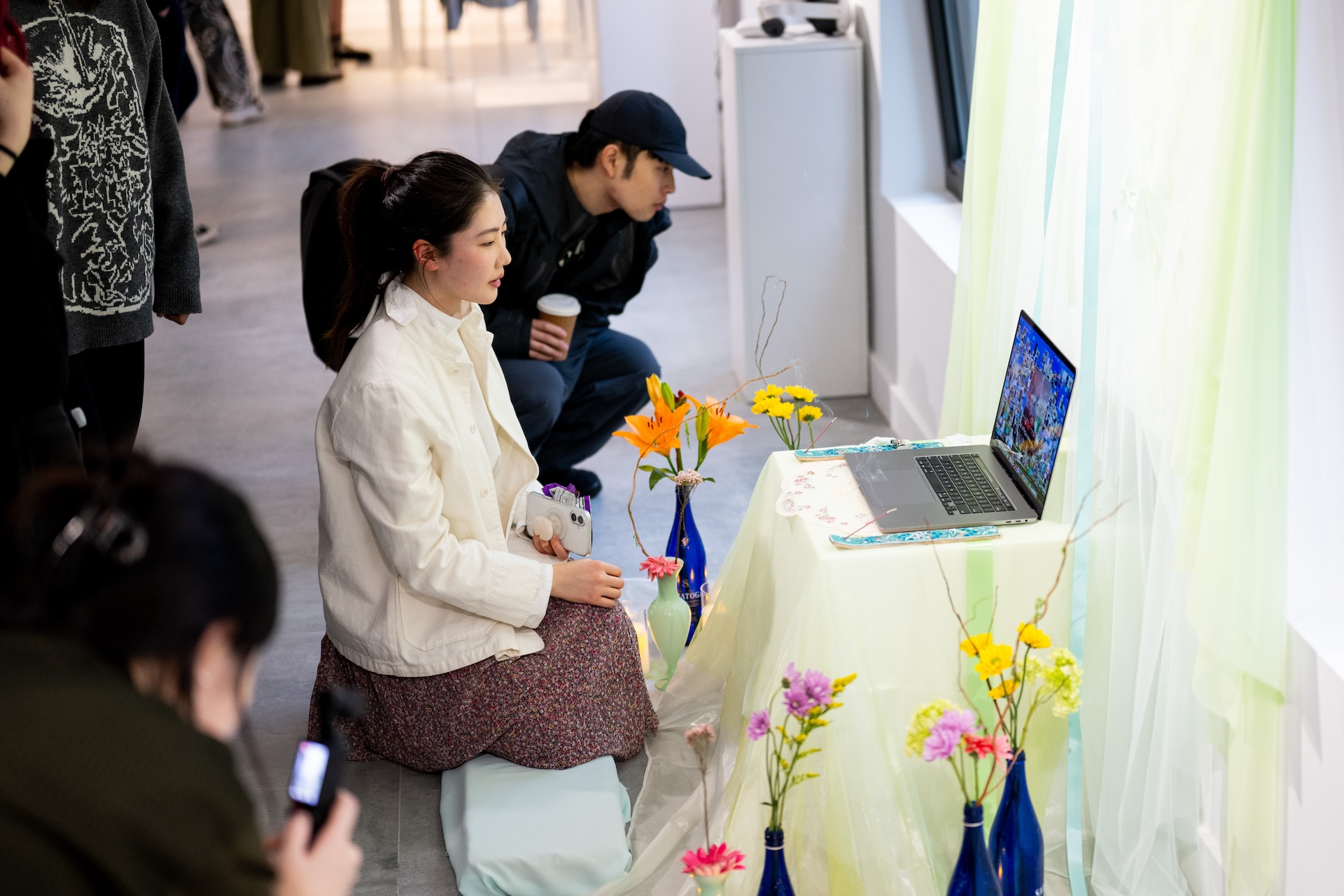 person kneeling and enjoying artwork
